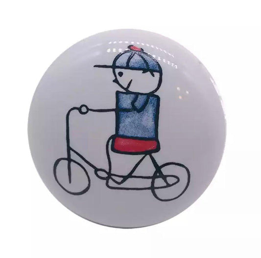 Porcelæns greb - dreng på cykel (Ø: 35 mm) - Grebet